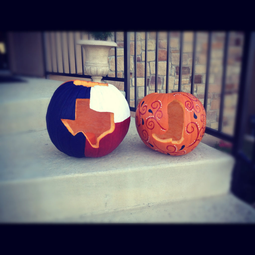 Two Jackolanterns in Texan Patterns sit on a Halloween stoop