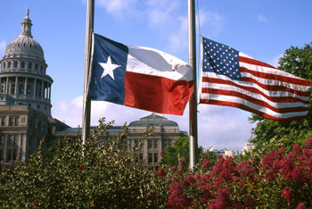 The Texas and United state flag fly at half mast in the wake of tragedy
